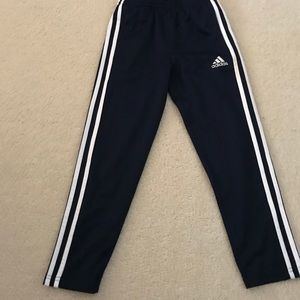 Black adidas pants with white stripes